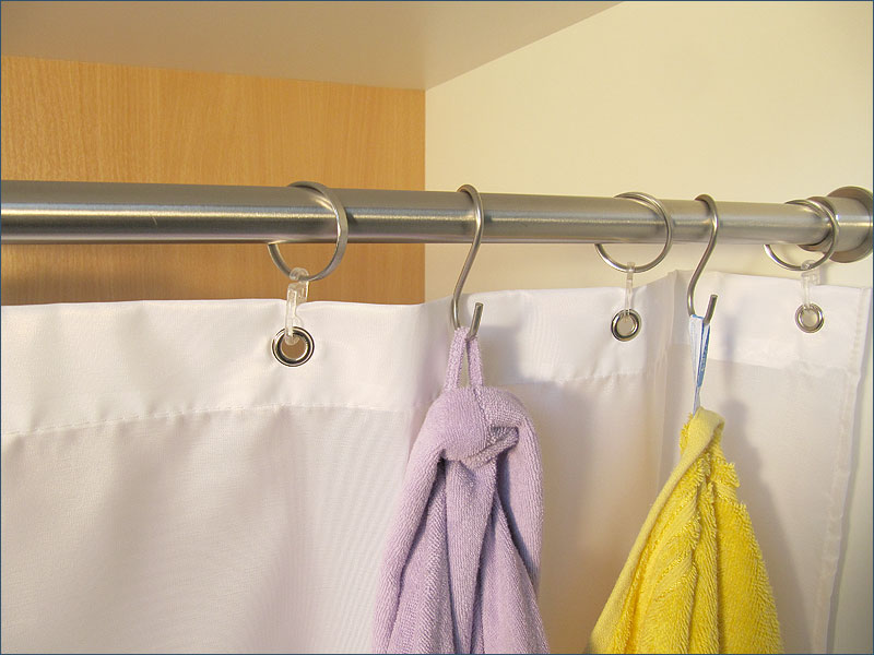 Rings for shower curtain together with stainless steel hooks as towel hooks or robe hooks