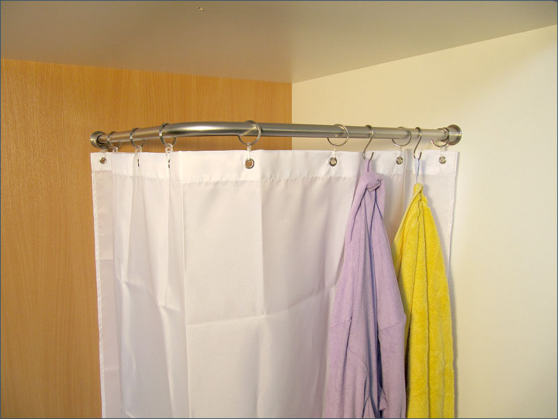 You can clip the bathrobe hook in or out at any point on the shower curtain rod