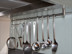 Stainless steel kitchen rail system with hooks, for range hood or cabinet