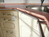 Custom-curved kitchen rail and towel holder for countertop edge