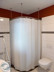 Shower curtain rail for floor-level corner shower, quadrant shape,attachment to the ceiling